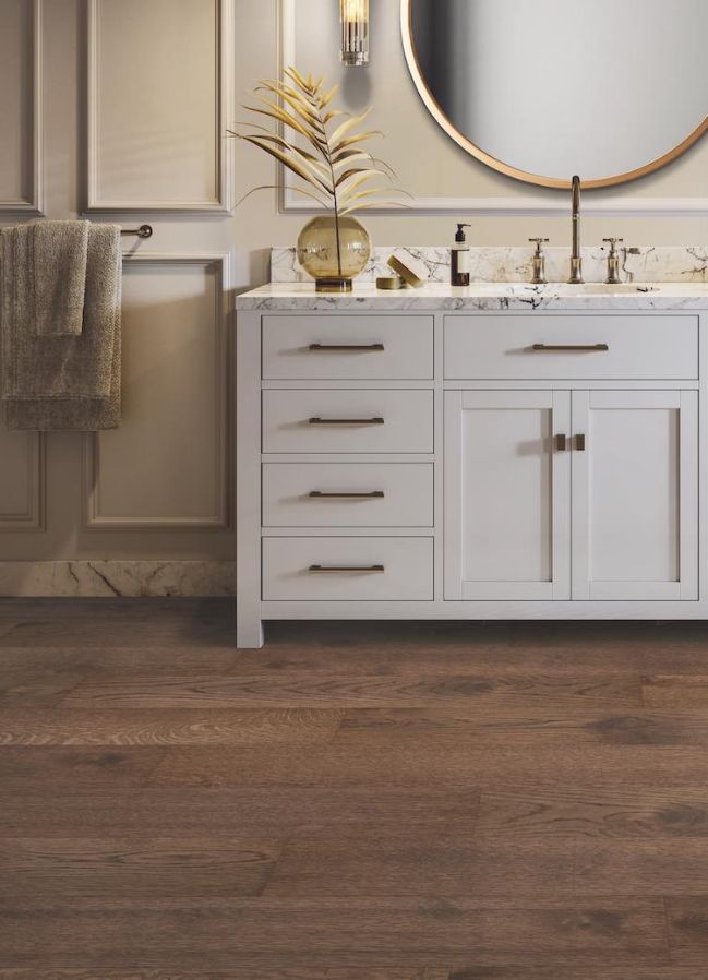 dark stained engineered wood floors in a stylish bathroom